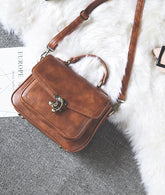Signature Swivel Satchel Bag